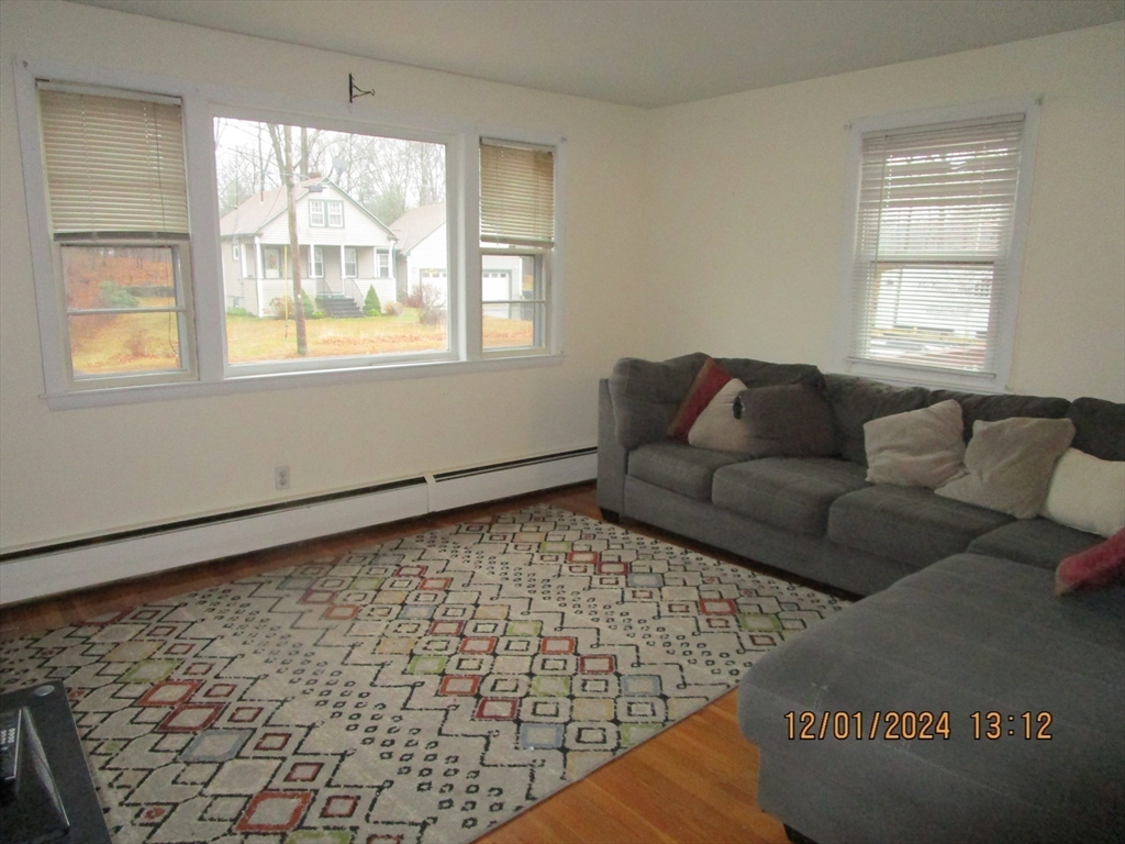 282 Central Street, Unit 1 Auburn, MA 01501 - Photo 11 of 16 a living room with furniture and a window