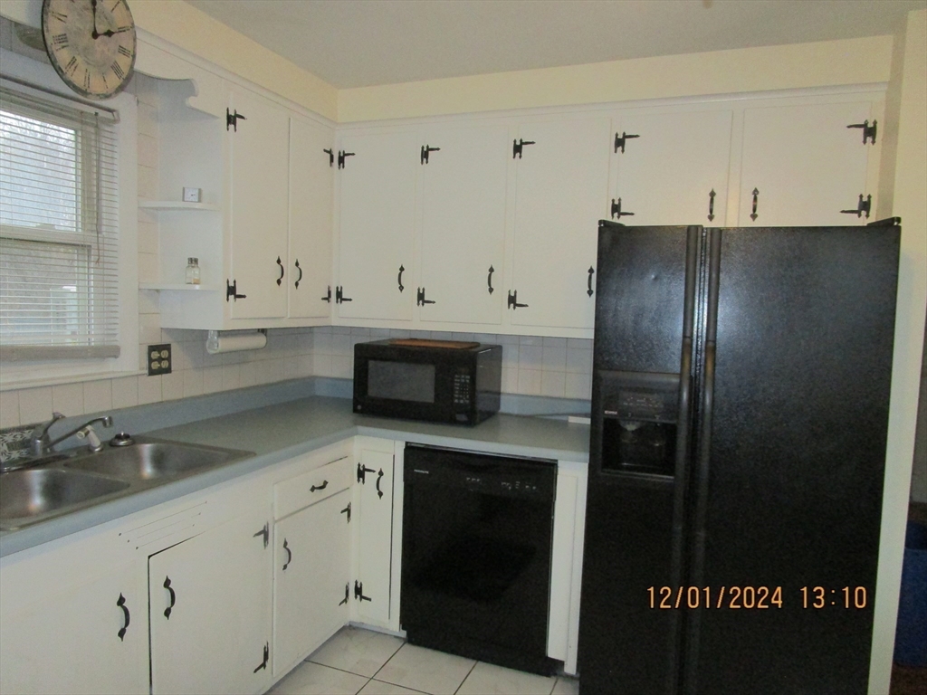 282 Central Street, Unit 1 Auburn, MA 01501 - Photo 10 of 16 a kitchen with stainless steel appliances granite countertop a refrigerator and a sink