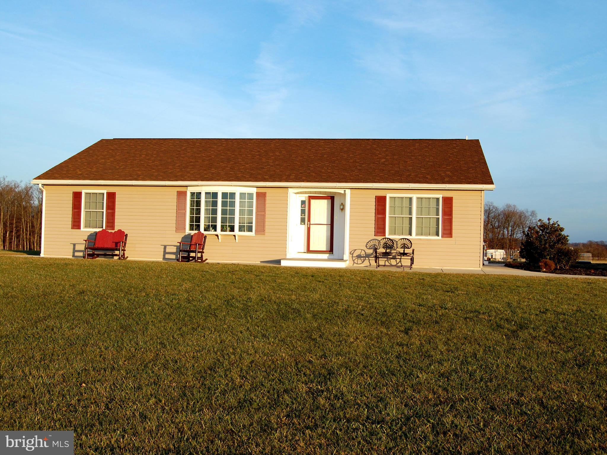 11747 Cash Smith Road Keymar, MD 21757 - Photo 1 of 14 a backyard of a house with table and chairs