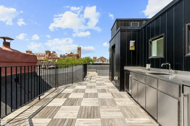 a en suite bathroom with a bathtub double sink and mirror
