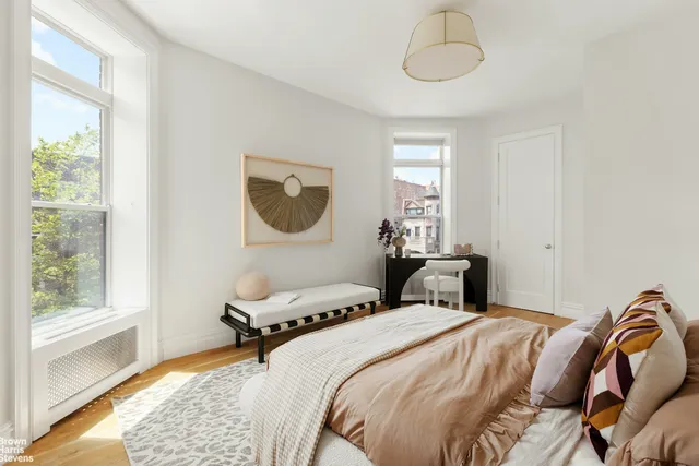 a bedroom with a bed and a lamp