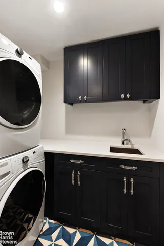 a living room with furniture rug and window