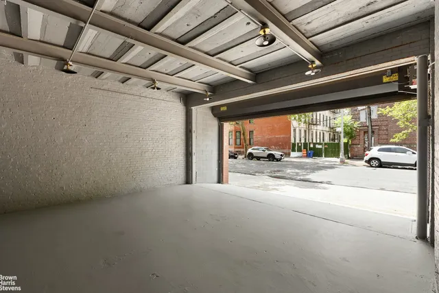 a view of a car garage with a large window