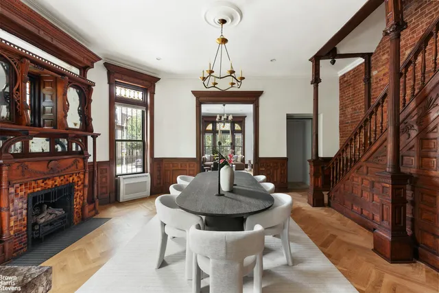 a living room with furniture a window and a fireplace