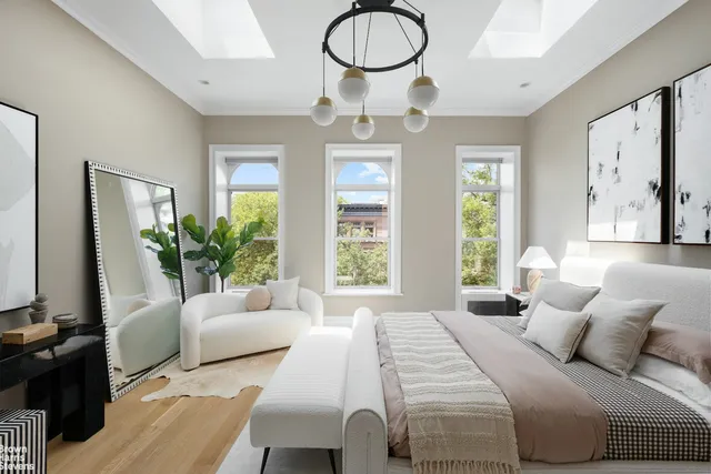 a kitchen with stainless steel appliances kitchen island a table and chairs in it
