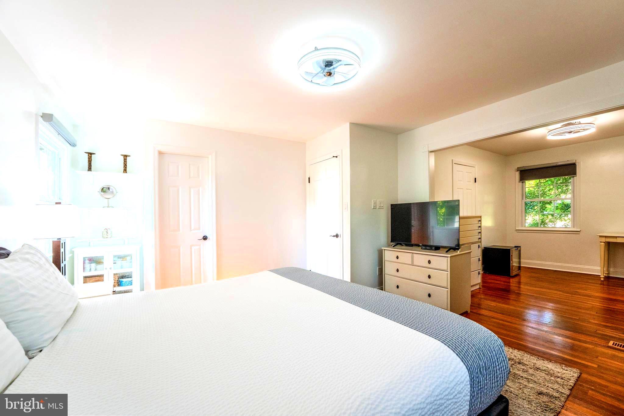 6705 Bracken Court Springfield, VA 22152 - Photo 18 of 40 a bedroom with a bed and a flat screen tv
