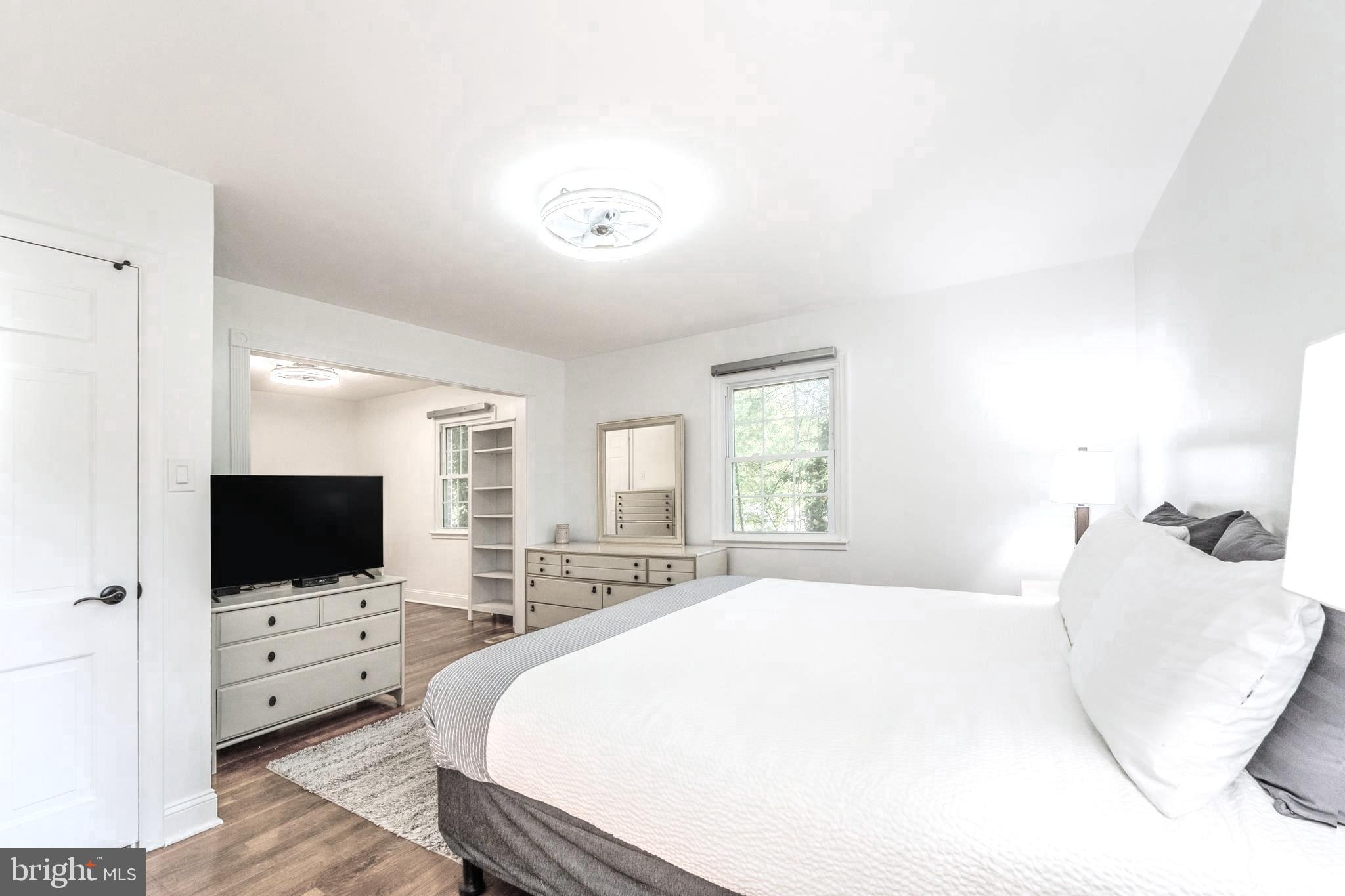 6705 Bracken Court Springfield, VA 22152 - Photo 19 of 40 a bedroom with a flat screen tv and a bed