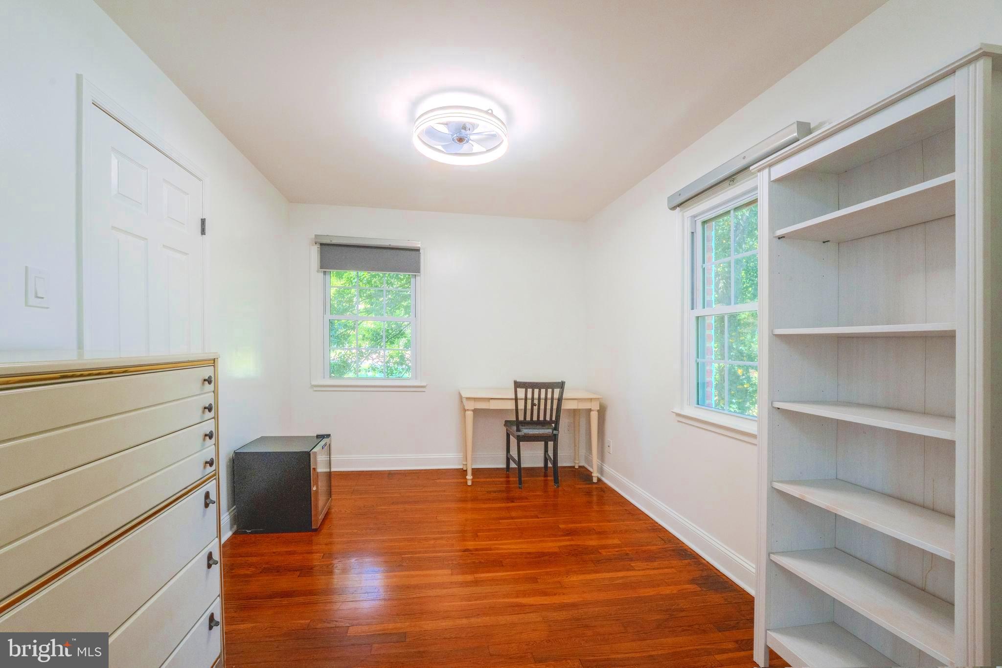 6705 Bracken Court Springfield, VA 22152 - Photo 20 of 40 a bedroom with a bed and a table in it