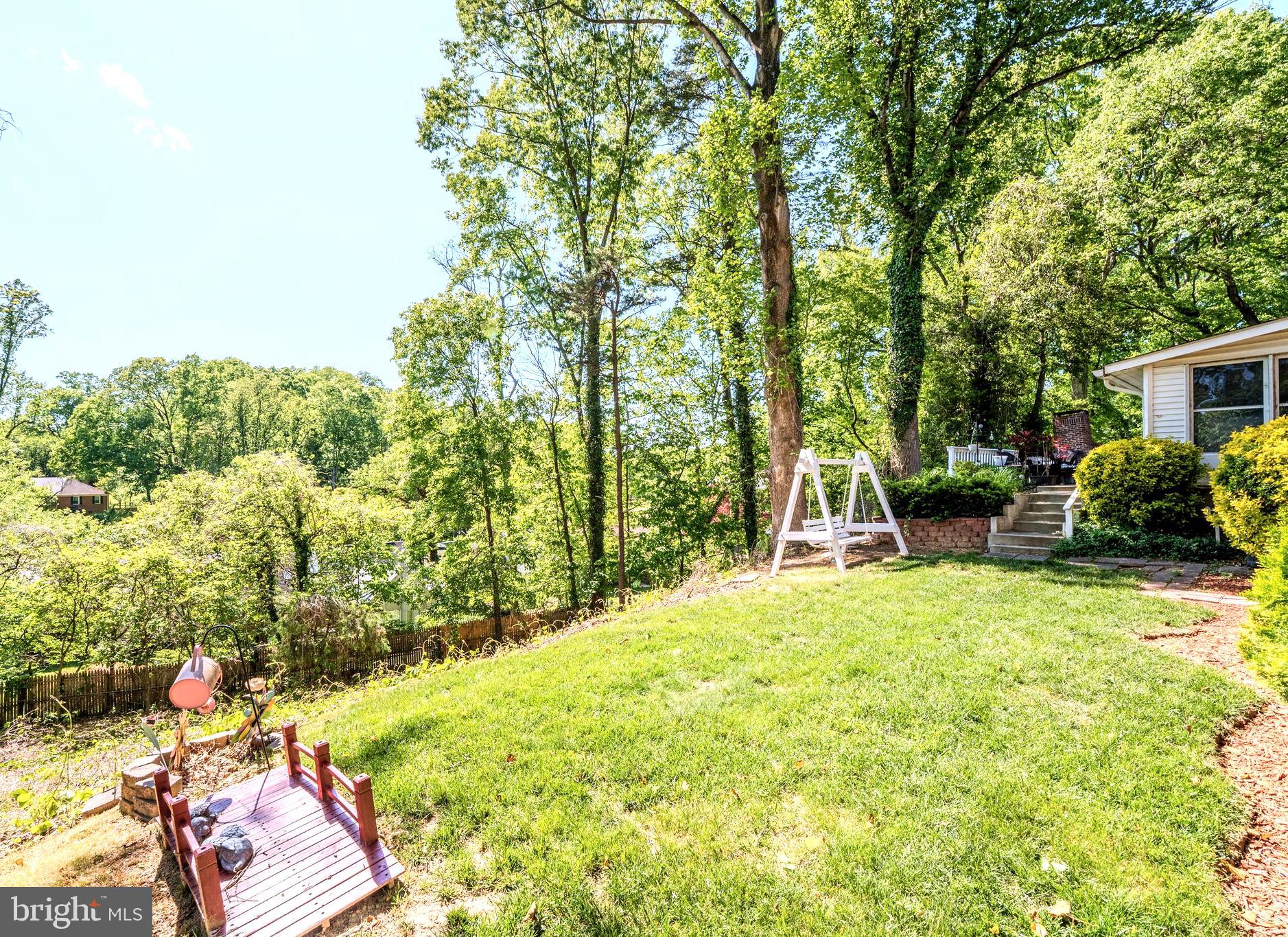 6705 Bracken Court Springfield, VA 22152 - Photo 39 of 40 a view of backyard with seating area and green space