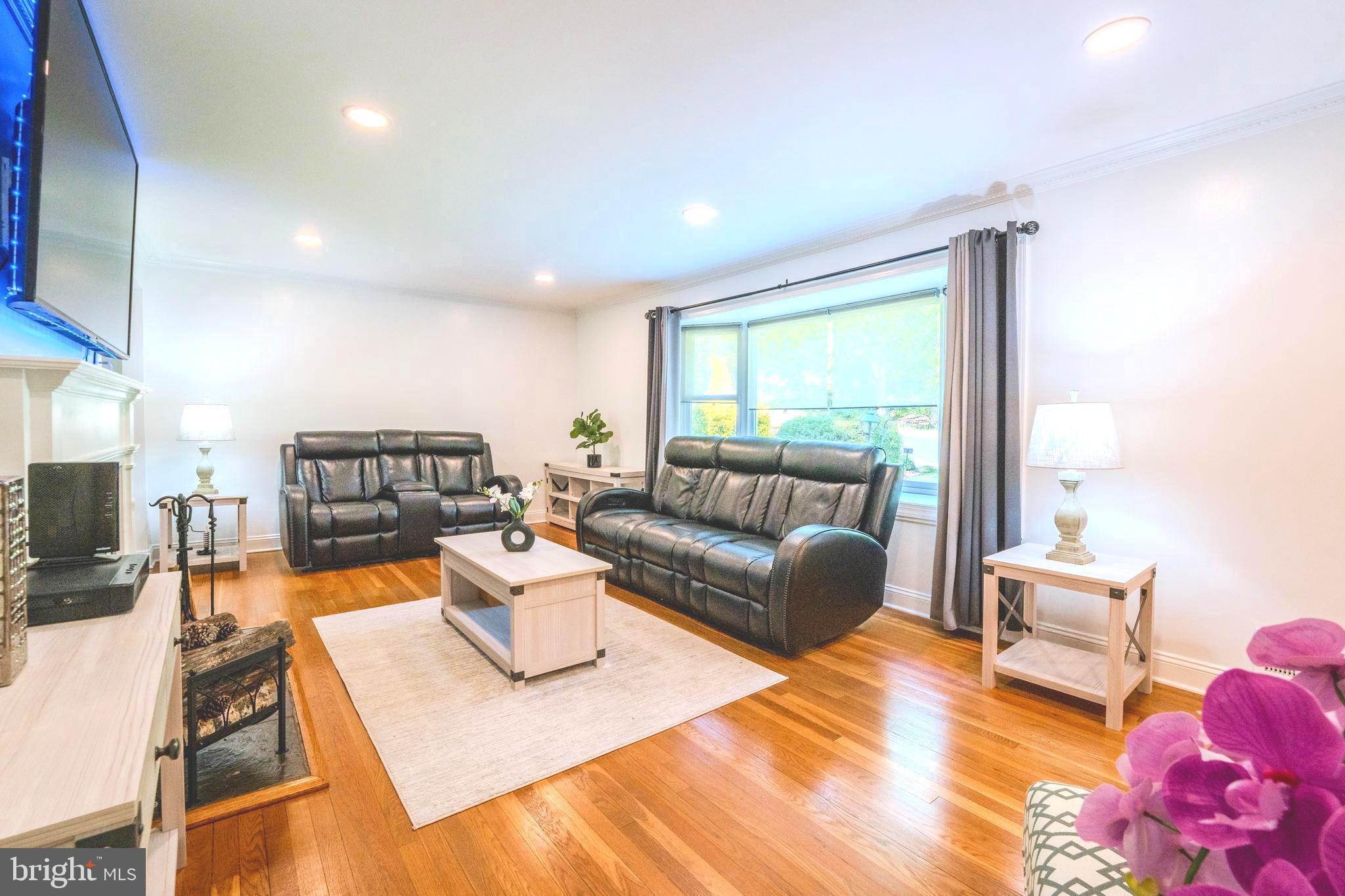6705 Bracken Court Springfield, VA 22152 - Photo 6 of 40 a living room with furniture and a large window