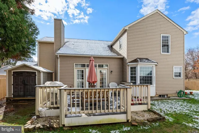 a front view of a house with yard porch and furniture