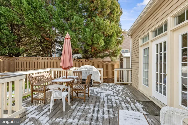 a view of a patio with a table and chairs