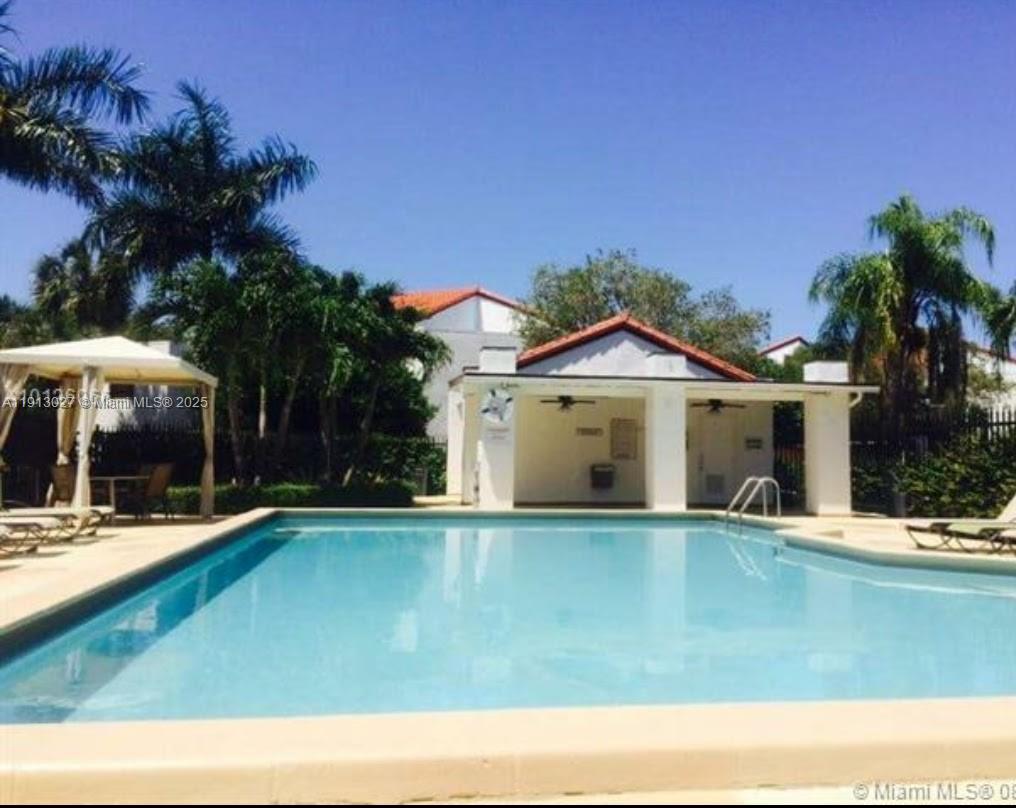 9409 Fontainebleau Boulevard, Unit 207 Miami, FL 33172 - Photo 18 of 19 a front view of a house with yard