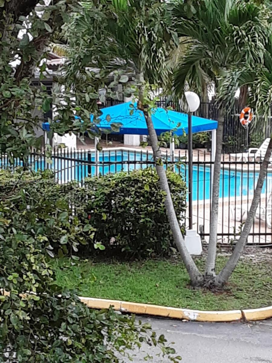 9409 Fontainebleau Boulevard, Unit 207 Miami, FL 33172 - Photo 19 of 19 a view of a garden