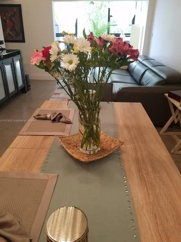 a vase of flowers sitting on a table