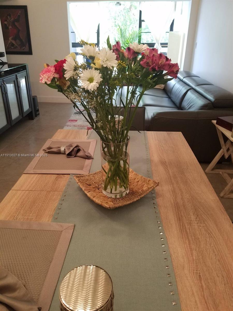 9409 Fontainebleau Boulevard, Unit 207 Miami, FL 33172 - Photo 9 of 19 a vase of flowers sitting on a table