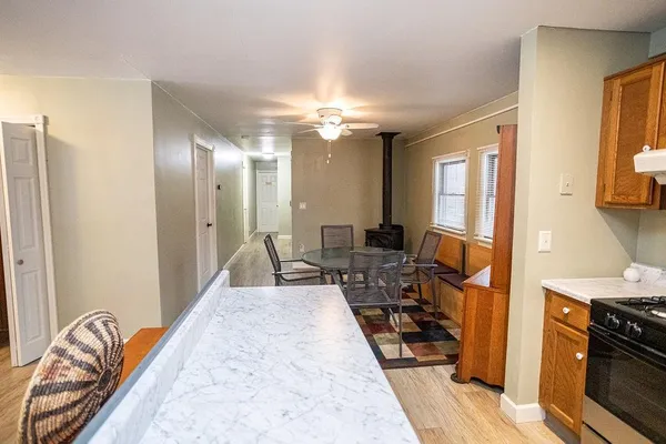 a dining room with a table and chairs