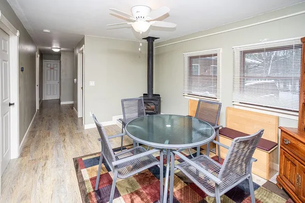 a dining room with furniture and a chandelier