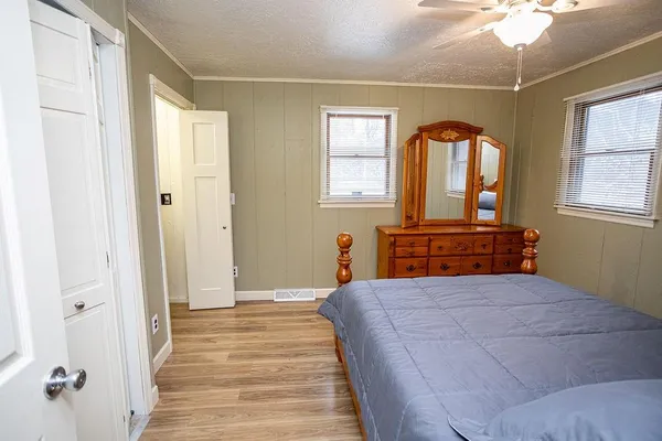 a bedroom with a bed and bathroom
