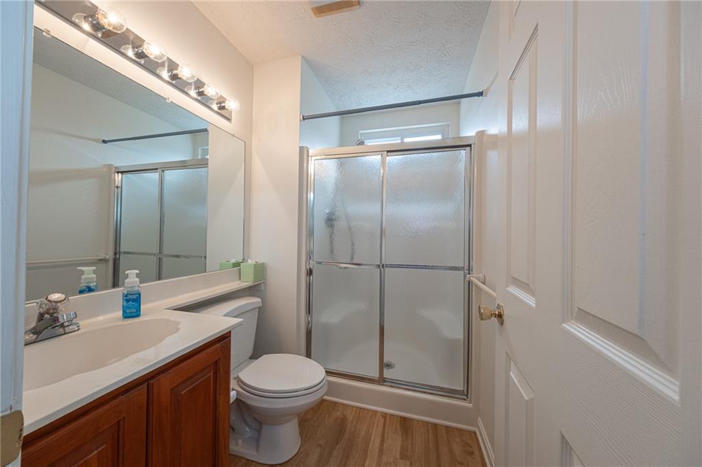306 Georgetown Lane Export, PA 15632 - Photo 17 of 35 a bathroom with a sink toilet and shower