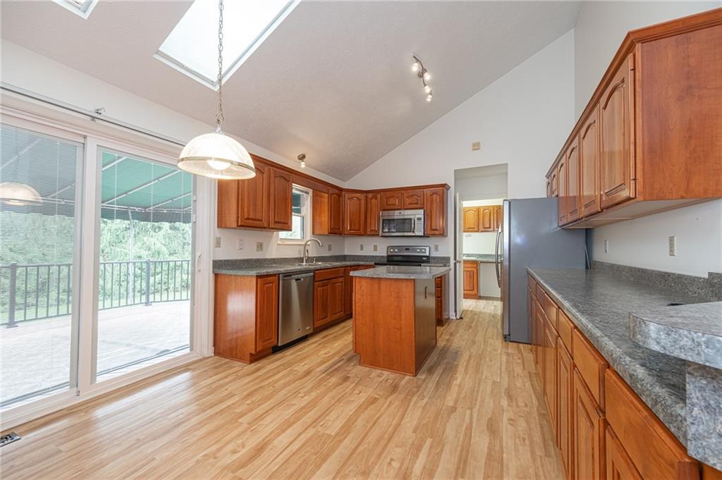 306 Georgetown Lane Export, PA 15632 - Photo 2 of 35 a kitchen with stainless steel appliances granite countertop a sink and wooden cabinets