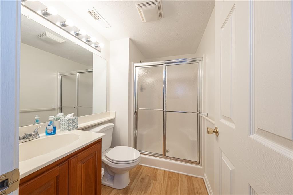 306 Georgetown Lane Export, PA 15632 - Photo 22 of 35 a bathroom with a sink a toilet and shower