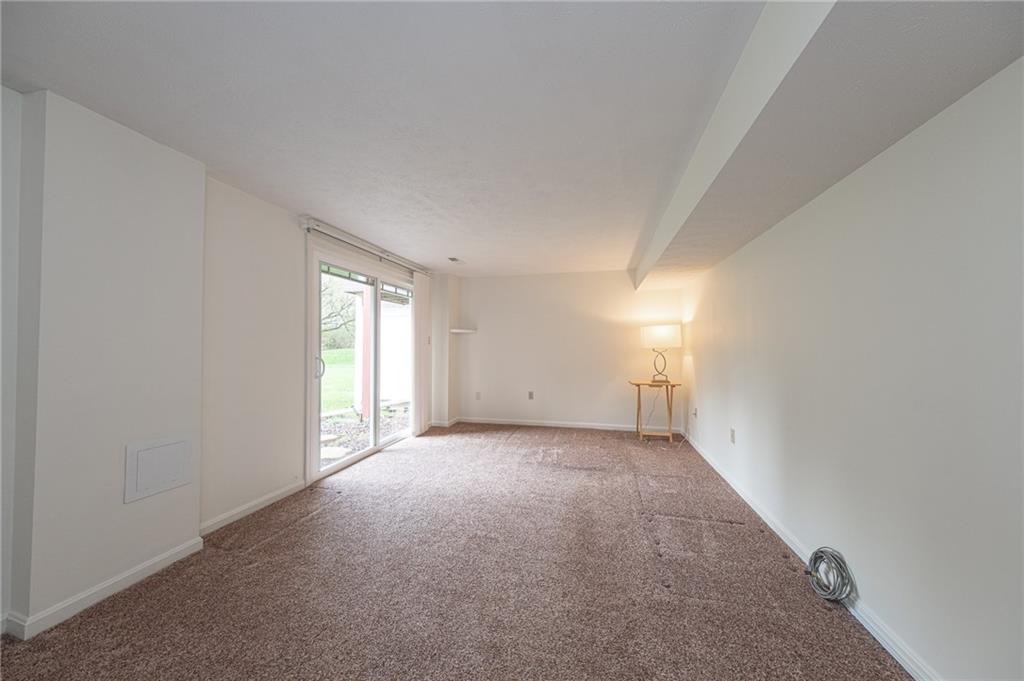306 Georgetown Lane Export, PA 15632 - Photo 24 of 35 a view of a big room with windows and chandelier fan