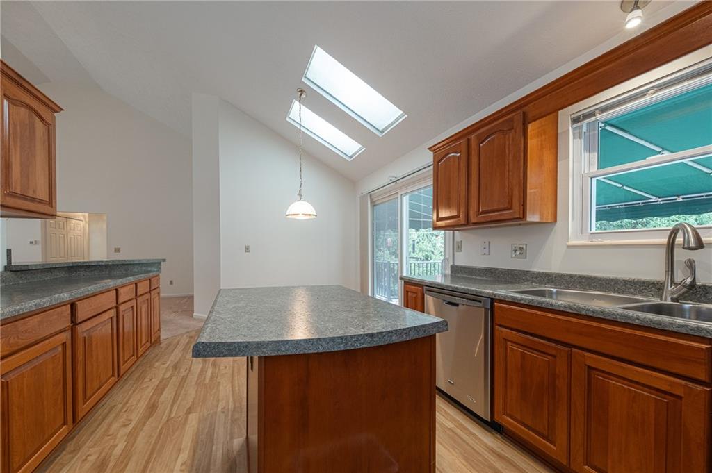 306 Georgetown Lane Export, PA 15632 - Photo 4 of 35 a kitchen with stainless steel appliances granite countertop a sink stove and cabinets