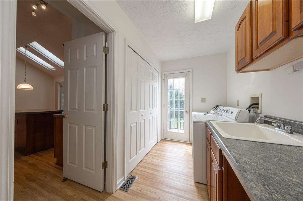 306 Georgetown Lane Export, PA 15632 - Photo 5 of 35 a view of a kitchen with a sink and dishwasher