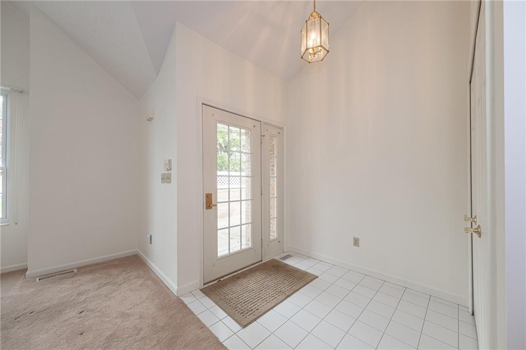 306 Georgetown Lane Export, PA 15632 - Photo 6 of 35 an empty room with windows