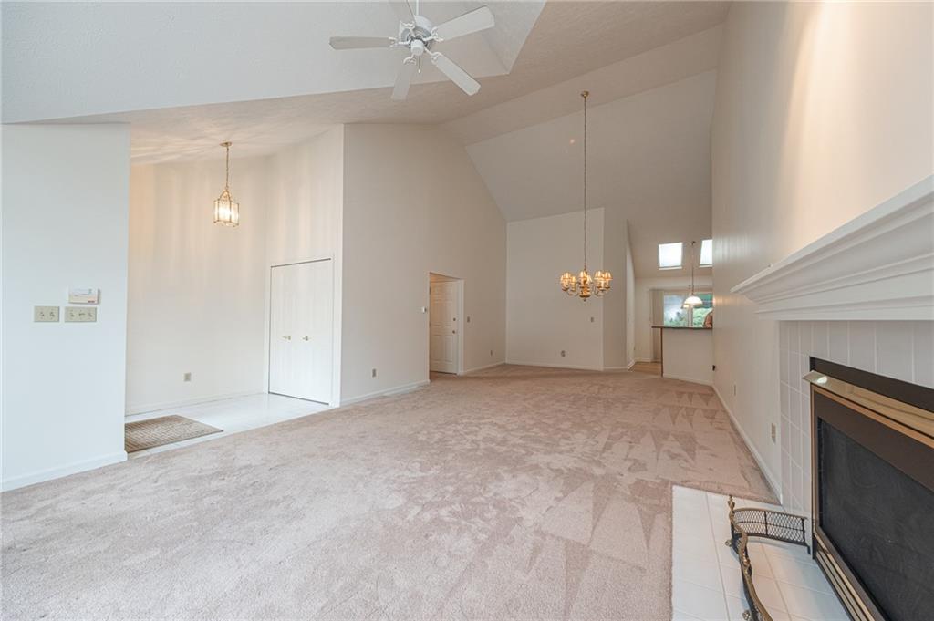 306 Georgetown Lane Export, PA 15632 - Photo 9 of 35 an empty room with ceiling fan and window