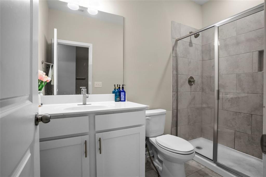 465 Duval Drive Alpharetta, GA 30009 - Photo 12 of 21 a bathroom with a sink toilet and shower