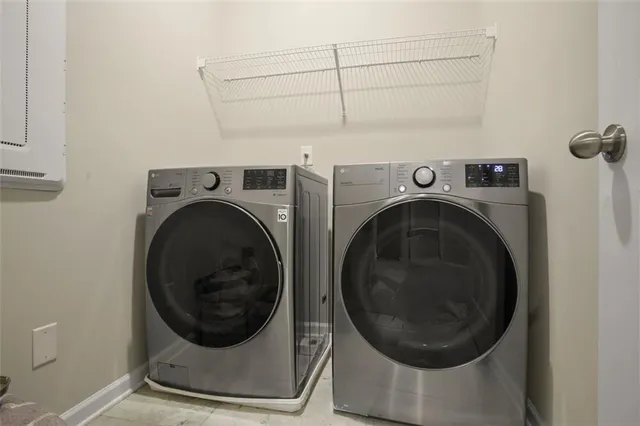 a utility room with dryer and washer