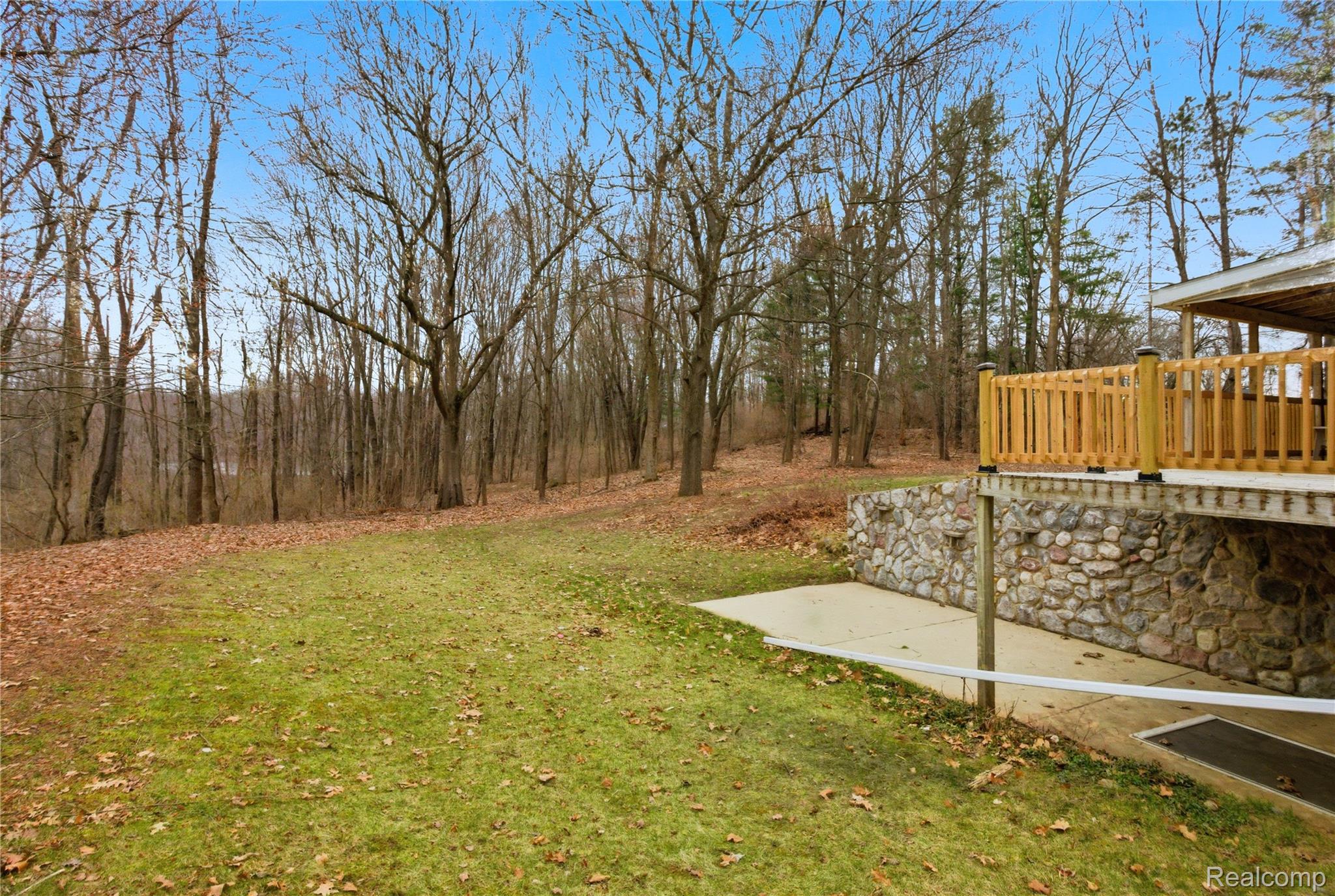 5350 List Road Grass Lake, MI 49240 - Photo 54 of 71 View of green lawn with a wooden deck