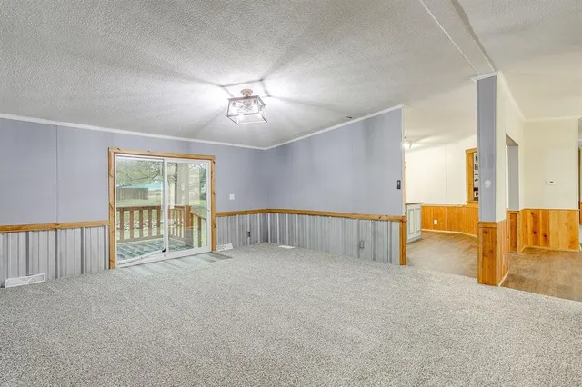 a kitchen with granite countertop a stove and a sink