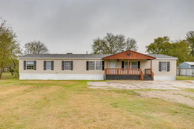 a front view of a house with swimming pool