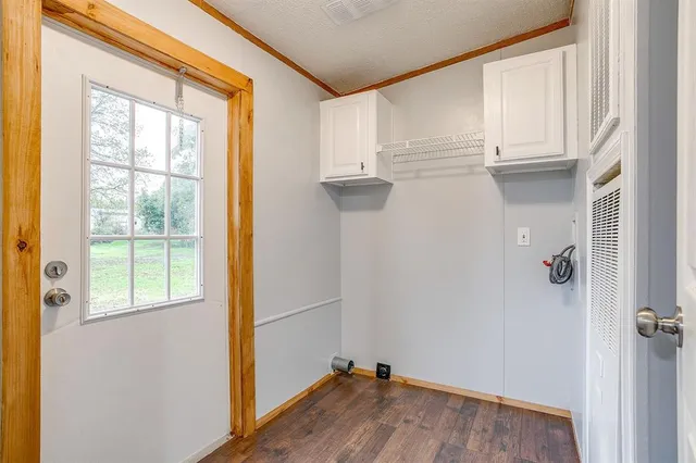 a view of a livingroom with a chandelier fan