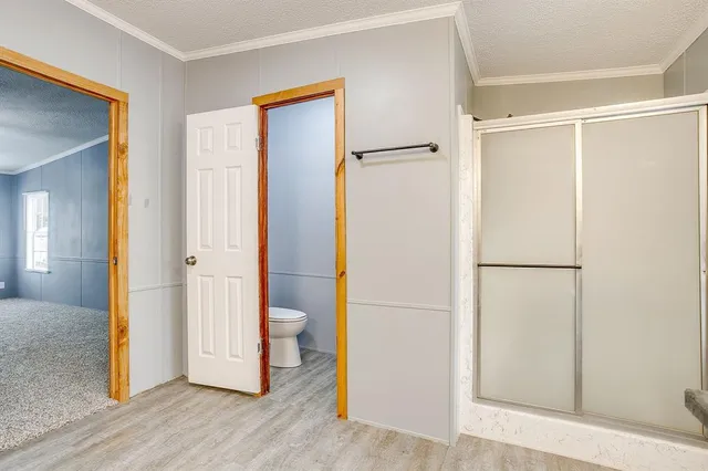 a kitchen with granite countertop a sink cabinets and stainless steel appliances