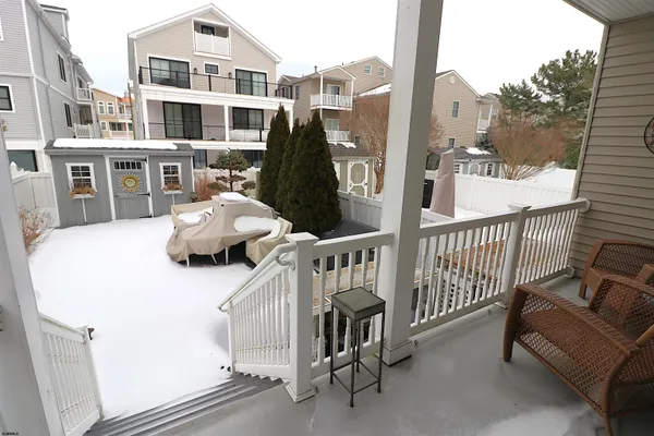 a view of a balcony with furniture