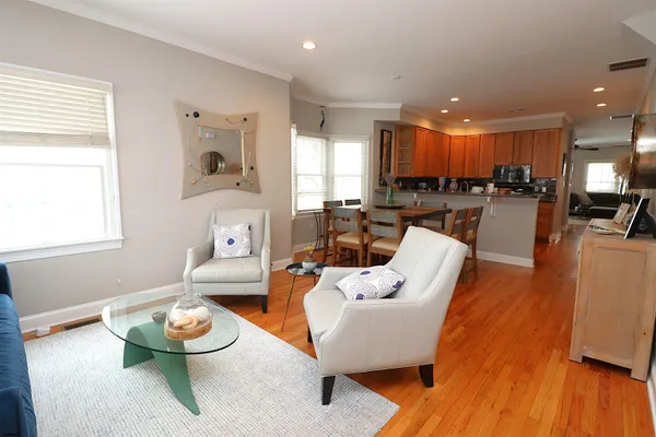 a view of a dining room with furniture and wooden floor
