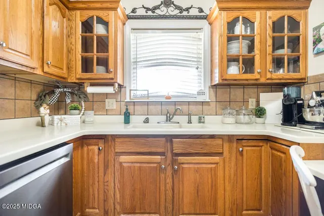 a kitchen with a sink and cabinets