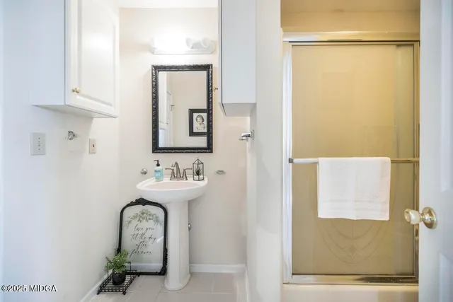 a bathroom with a mirror and a sink