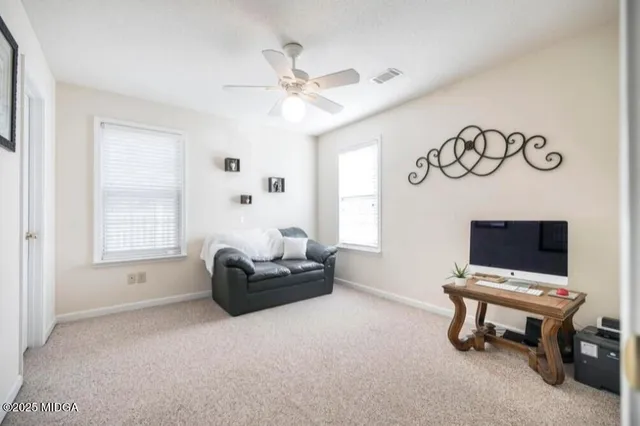 a living room with furniture and a window