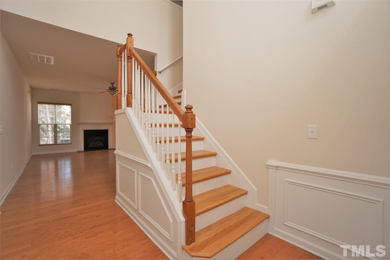 7718 Tanby Court Raleigh, NC 27613 - Photo 17 of 20 a view of entryway and hall with wooden floor