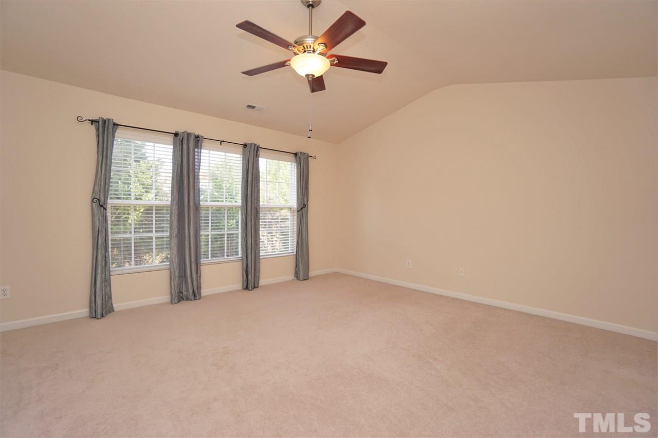7718 Tanby Court Raleigh, NC 27613 - Photo 9 of 20 a view of an empty room with a window