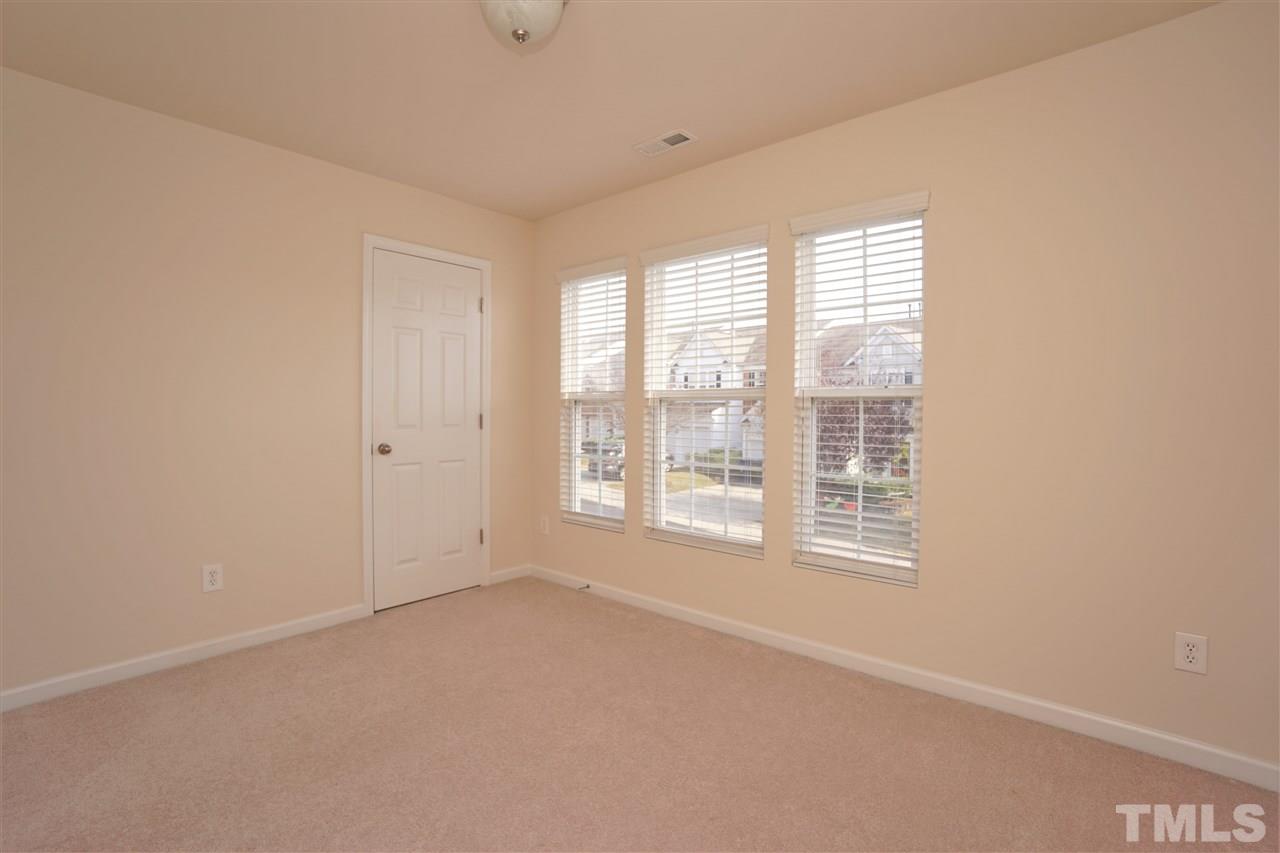7718 Tanby Court Raleigh, NC 27613 - Photo 10 of 20 a view of an empty room with a window