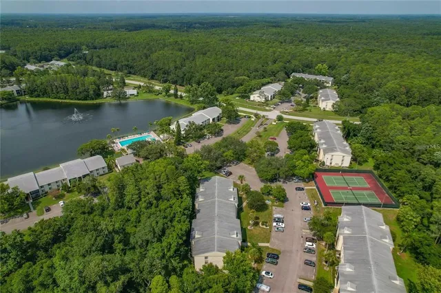 an aerial view of a house with garden space and street view