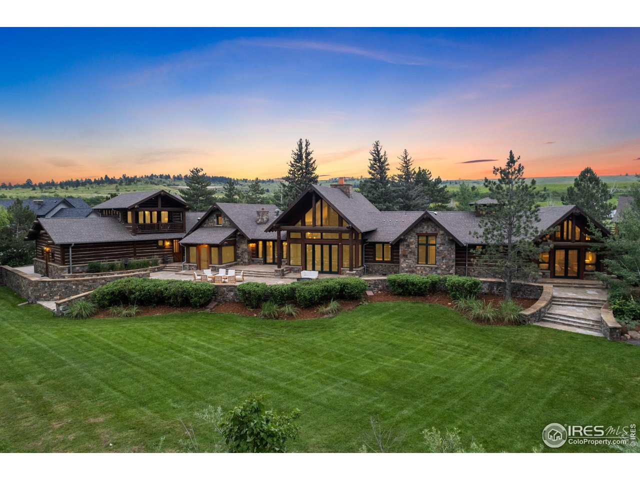 4651 Eldorado Springs Drive Boulder, CO 80303 - Photo 1 of 40 a view of a big house with a big yard and large tree