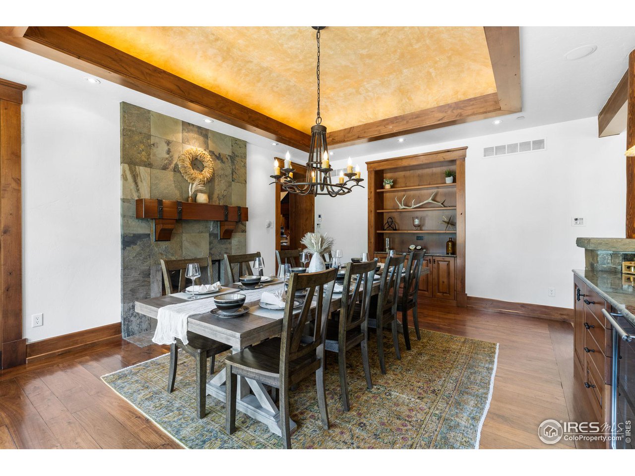 4651 Eldorado Springs Drive Boulder, CO 80303 - Photo 13 of 40 a view of a dining room with furniture and chandelier