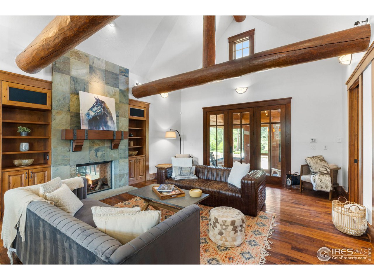 4651 Eldorado Springs Drive Boulder, CO 80303 - Photo 15 of 40 a living room with furniture a large window and wooden floor